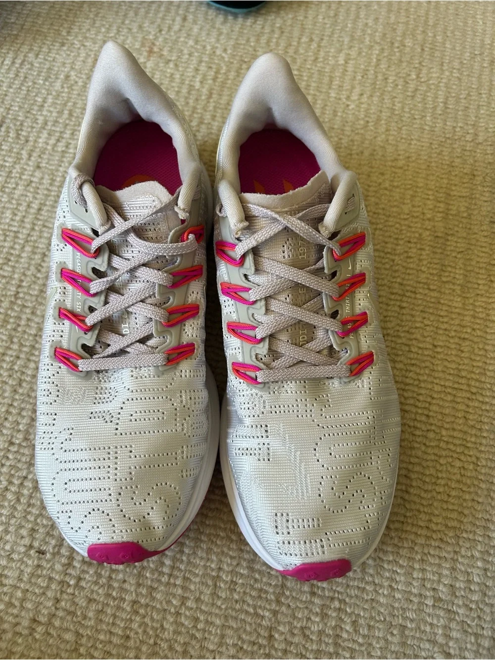Nike Women's Light Beige Athletic Sneakers with Pink Accents